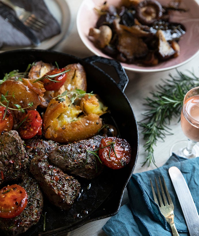ROSEMARY AND PAPRIKA BEEF MEDALLIONS WITH FRIED TOMATOES & GREEN HERB SAUCE
