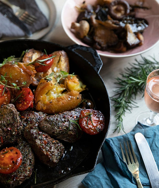 ROSEMARY AND PAPRIKA BEEF MEDALLIONS WITH FRIED TOMATOES & GREEN HERB SAUCE