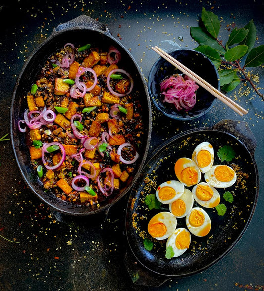 Black rice congee with tofu and boiled eggs