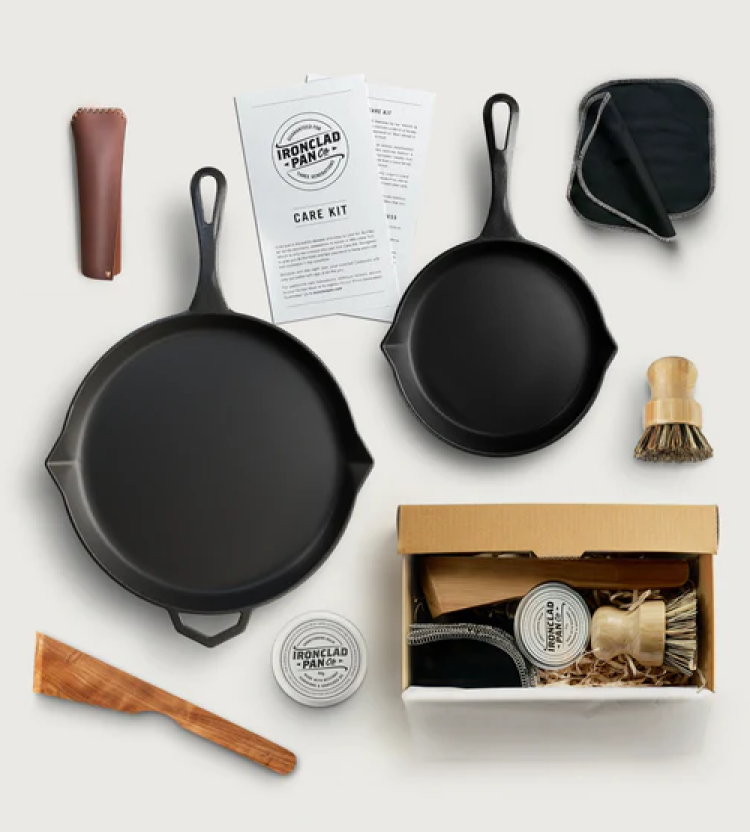 Cast iron skillet set with accessories and care instructions.